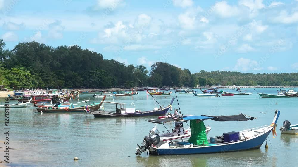 beach with long boats moored in Phi Phi Island bay beach with long boats moored in Phi Phi Island bay