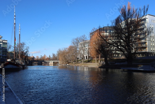 Sweden. Houses and a ship on a Kinda channel in Linköping. Ostergotland province. photo