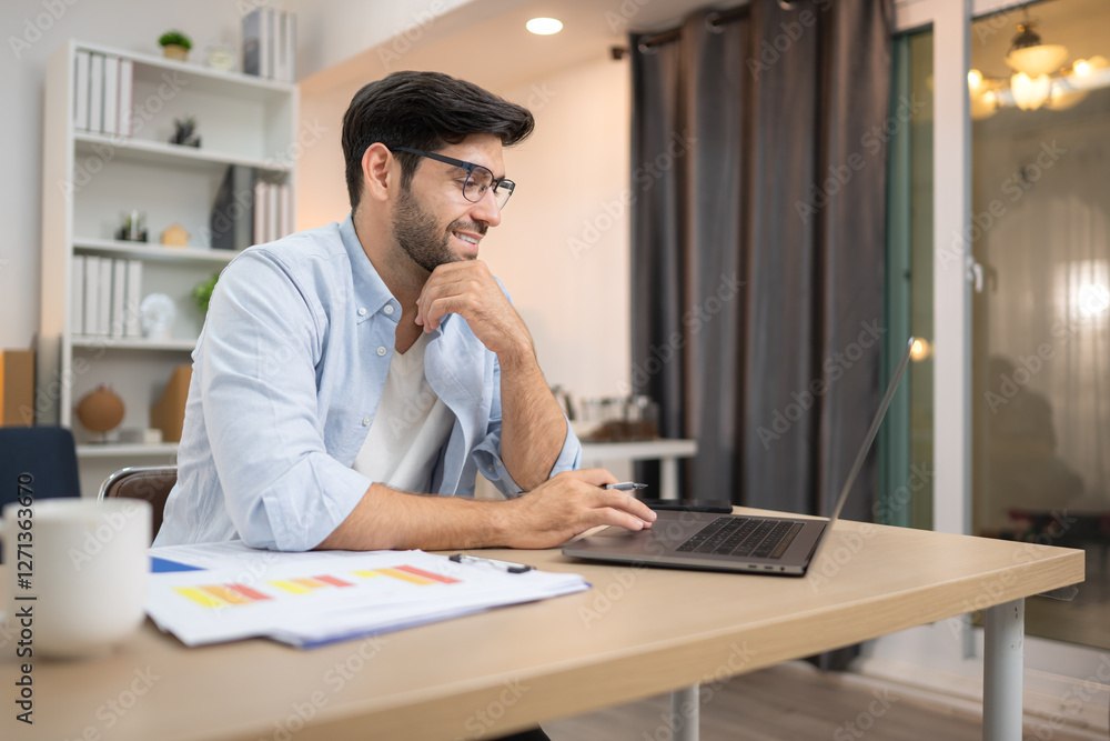 Portrait of a young freelancer smiling while working online via laptop at home Portrait of a young freelancer smiling while working online via laptop at home