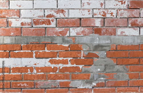Obraz na płótnie Weathered brick wall with peeling white paint and exposed red bricks w salonie