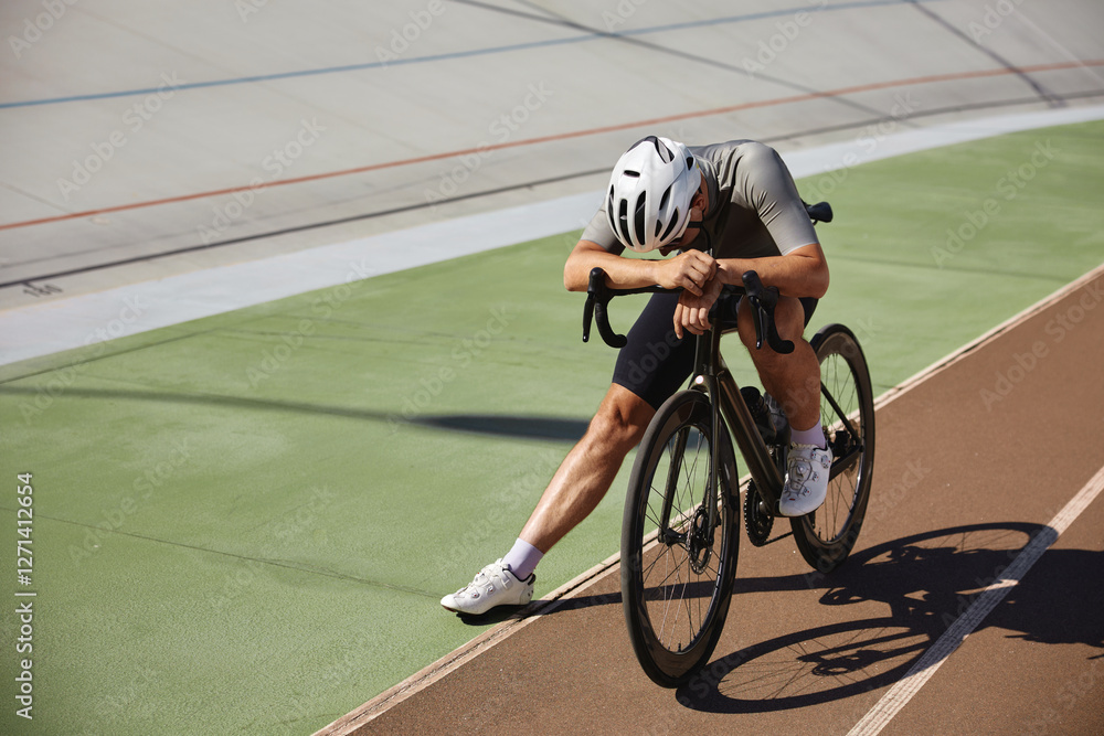 Tired exhausted bicyclist athlete stopped after hard cycling training