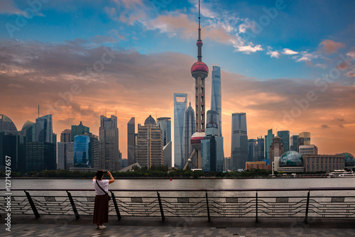 Photography Shanghai city skyline seen from water at sunset, China