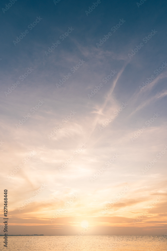 Obraz premium Sunset sky vertical in the evening with blue and orange sunrise on clouds fluffy in golden hour over sea, Horizon sky summer background