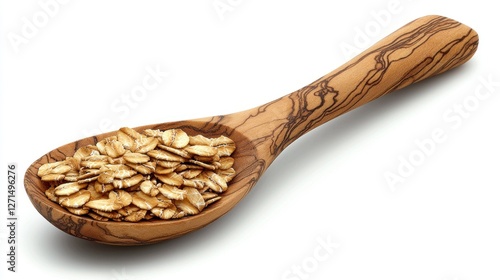 Wooden spoon holding rolled oats on white background