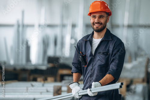 In protective hard hat. Man is working in the modern factory photo