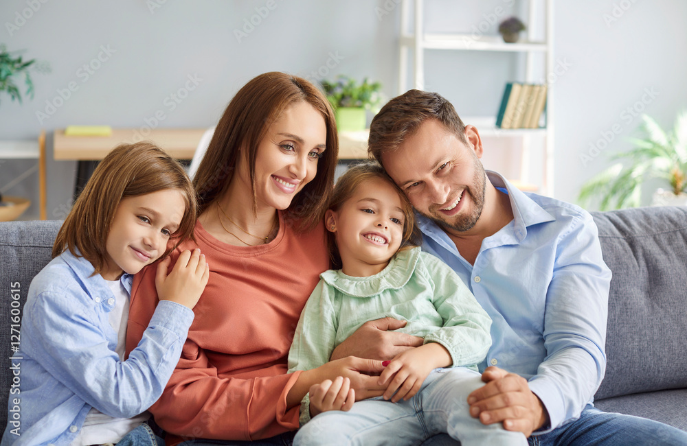 Portrait of a happy parents and children embracing on the couch at home, sharing affection and bonding. The family enjoys leisure time together, reflecting their love and connection. Portrait of a happy parents and children embracing on the couch at home, sharing affection and bonding. The family enjoys leisure time together, reflecting their love and connection.