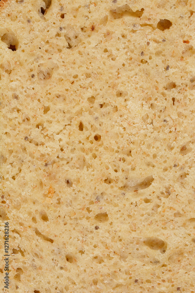 A close-up of a slice of homemade bread with chia seeds, showcasing its texture A close-up of a slice of homemade bread with chia seeds, showcasing its texture