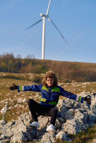 An African American Engineer Celebrates the Successful Completion of a Wind Turbine Project. photo