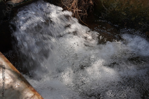 The water flow is coming through the pipeline in speed