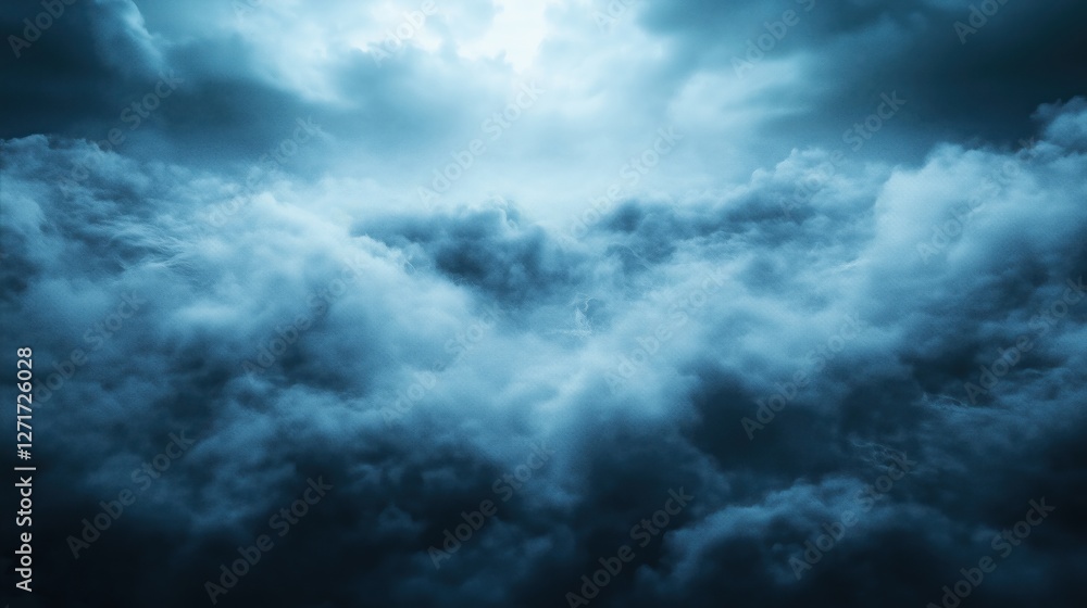 Obraz premium A stunning view of dark blue clouds swirling in the sky, creating a moody atmosphere.