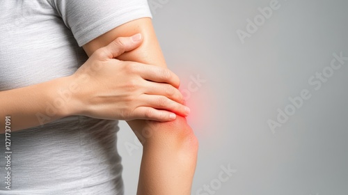 Wallpaper Mural Woman holding elbow with painful red spot, understanding elbow pain, causes, and treatment options Torontodigital.ca