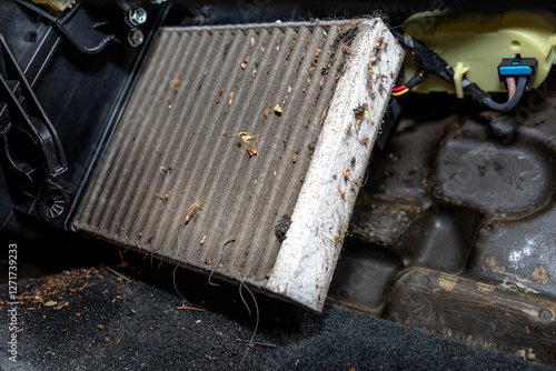 Wallpaper Mural Removing a dirty cabin filter from a cars dashboard, difficult access. Torontodigital.ca