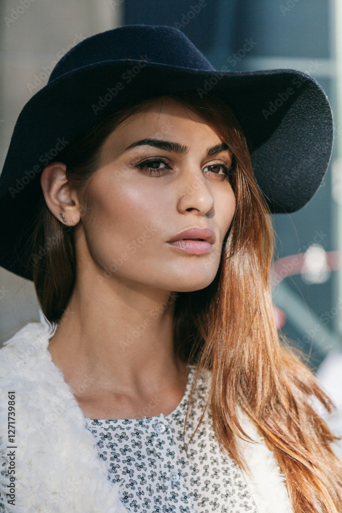 Woman in wide-brimmed hat with casual stylish look Woman in wide-brimmed hat with casual stylish look