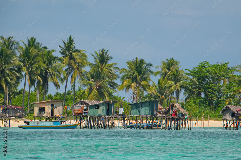East Malaysia. island of Borneo. November 29, 2018. Sea Gypsy village on a sandy coral reef island. The main trade of local residents is fishing and sea Souvenirs. East Malaysia. island of Borneo. November 29, 2018. Sea Gypsy village on a sandy coral reef island. The main trade of local residents is fishing and sea Souvenirs.