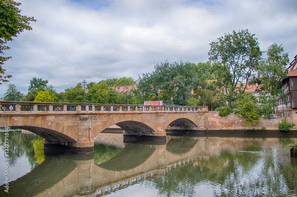 Maxbrucke or Maxbruecke is an arch bridge over the Pegnitz river in the old town of Nuremberg. Maxbrucke or Maxbruecke is an arch bridge over the Pegnitz river in the old town of Nuremberg.