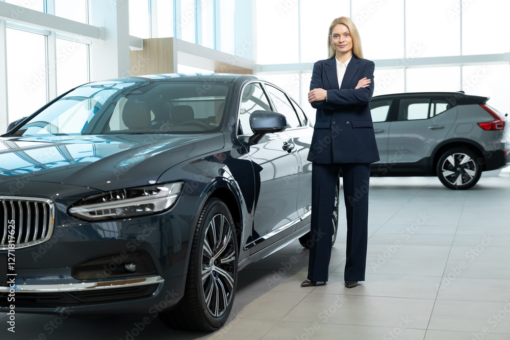 Blonde woman in elegant suit in the car showroom Blonde woman in elegant suit in the car showroom