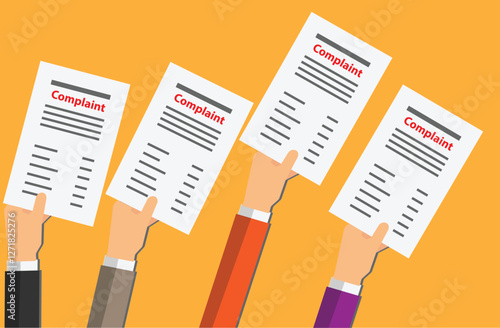 Hands of persons holding a paper with the word complaint