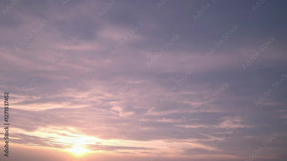 slow flight over the morning sky with pink clouds from which the sun rises slow flight over the morning sky with pink clouds from which the sun rises