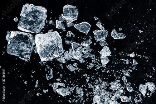 A crushed ice shards on a black background.Particles of crushed ice spread away.
