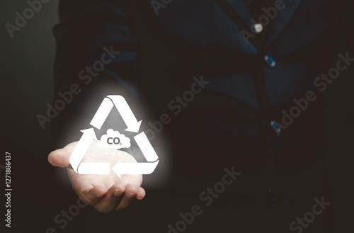 man hold the co2 icon in hand. air pollution concept.responsibility and impact air sustainability world resource, warming, climate change, efficiency, global warming, renewable, sustainable. photo