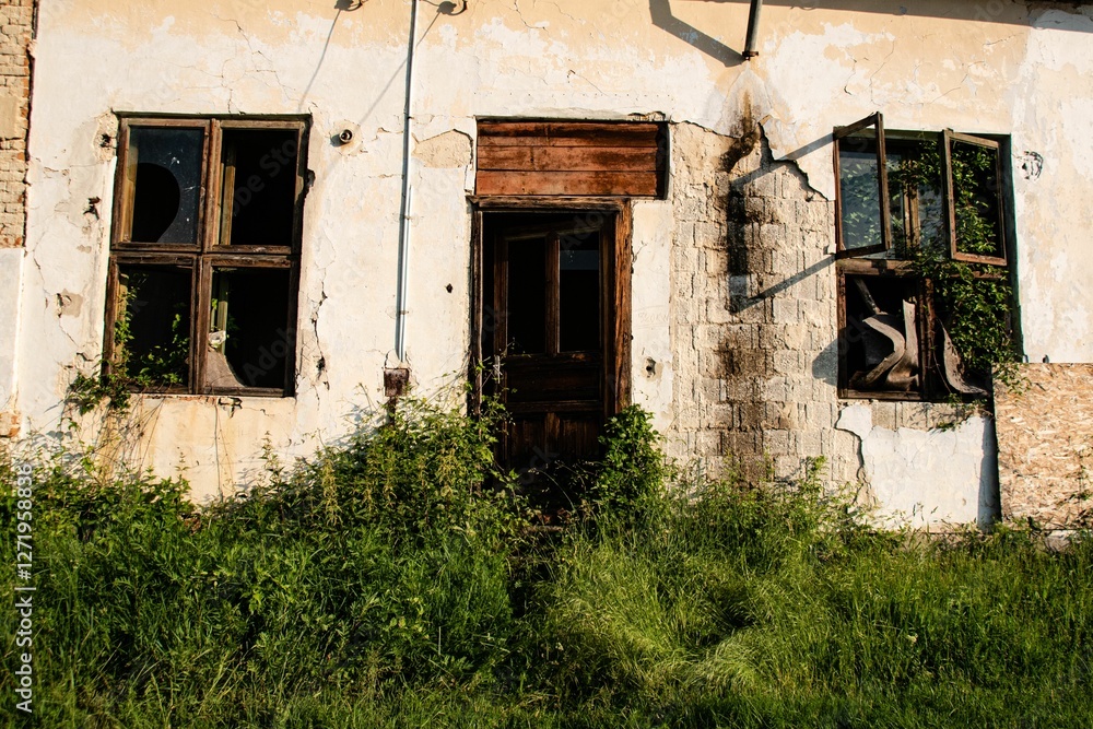 Abandoned rustic building with broken windows. Abandoned rustic building with broken windows.