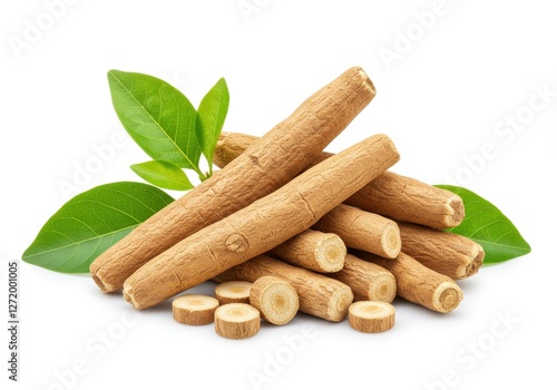 A pile of ashwagandha roots with fresh green leaves isolated on a white background