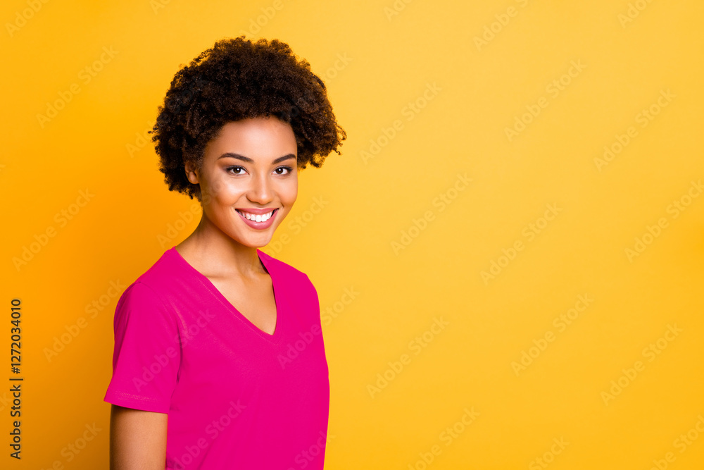 Close up photo of amazing dark skin lady with beaming smile wear orange v neck t-shirt isolated yellow color background Close up photo of amazing dark skin lady with beaming smile wear orange v neck t-shirt isolated yellow color background