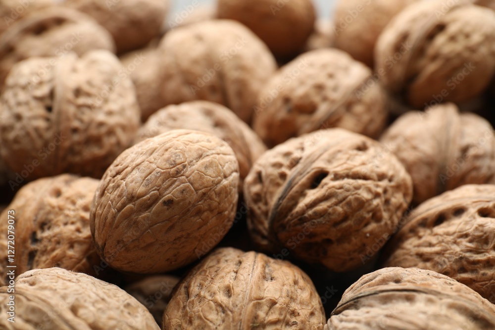 Fresh walnuts in shells as background, closeup Fresh walnuts in shells as background, closeup