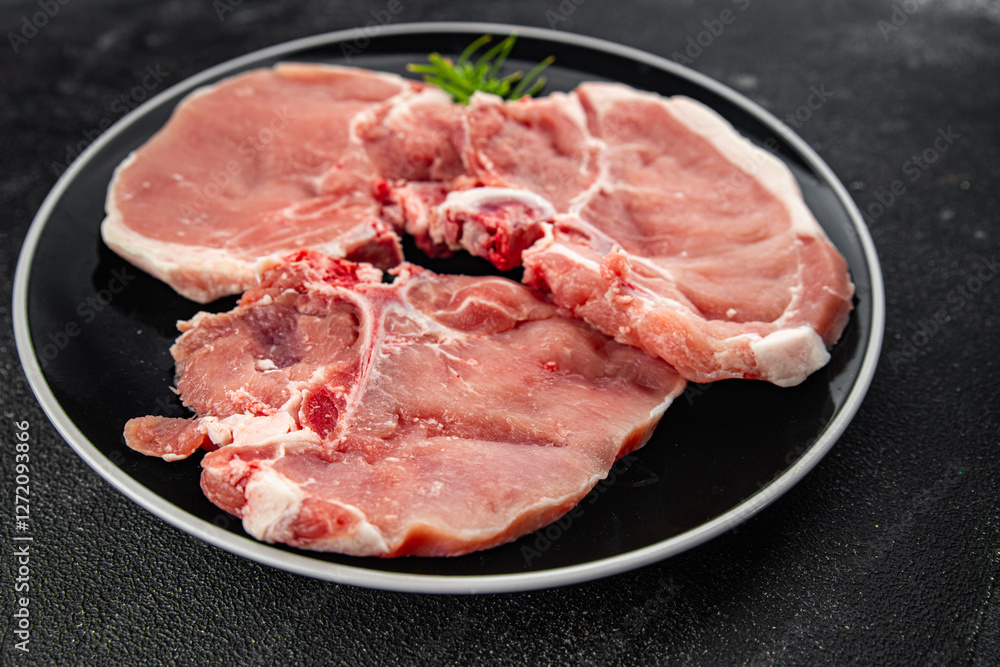 Raw pork on bones meat fresh tasty food dish delicious gourmet food background on the table rustic food top view copy space Raw pork on bones meat fresh tasty food dish delicious gourmet food background on the table rustic food top view copy space