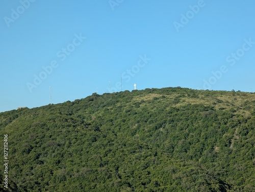 Mountains near the city of Villa Carlos Paz in central Argentina. White cross on top photo