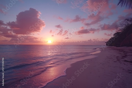 Obraz na płótnie Sunset over calm ocean waters with gentle waves lapping on sandy beach in tropical paradise location w salonie