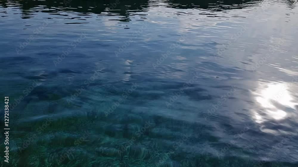 Calm lake water reflecting soft light, nature tranquility. Peaceful outdoor concept Calm lake water reflecting soft light, nature tranquility. Peaceful outdoor concept