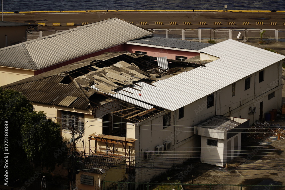 Fototapeta premium Hazardous asbestos, eternit as a building material. This material is banned in many countries due to the cancer risk posed by microfibers. Here the replacement of Eternit roof panels of aluminum.