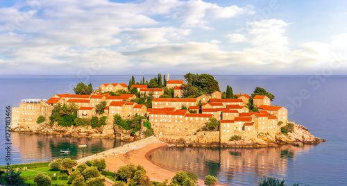 panoramic landscape of sea island sunrise or sunset with beautiful orange roofs and buildings, sea gulf water and scrnic colorful morning cloudy sky on background photo