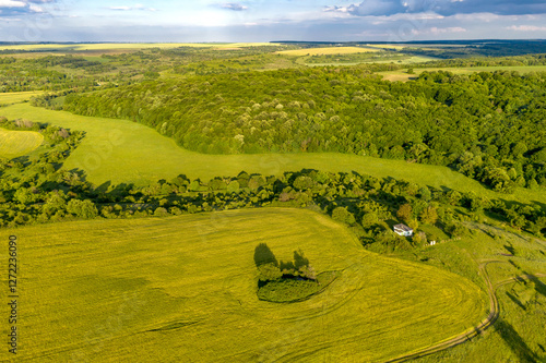 Obraz na płótnie Aerial view from drone of the vast landscape of the green countryside w salonie