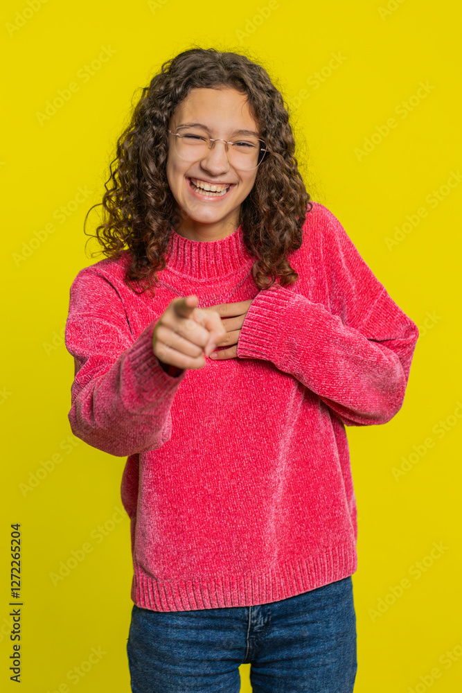 Caucasian girl pointing finger to camera, laughing out loud, taunting making fun of ridiculous appearance, funny joke anecdote, bullying, abuse. Young teen child isolated on yellow background indoors Caucasian girl pointing finger to camera, laughing out loud, taunting making fun of ridiculous appearance, funny joke anecdote, bullying, abuse. Young teen child isolated on yellow background indoors