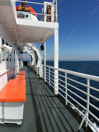 Deck on ferry boat in open water photo