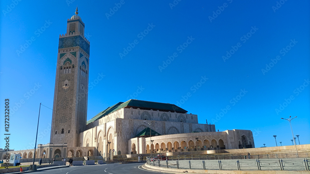 Fototapeta premium Hassan ii mosque standing tall under blue sky in casablanca, morocco
