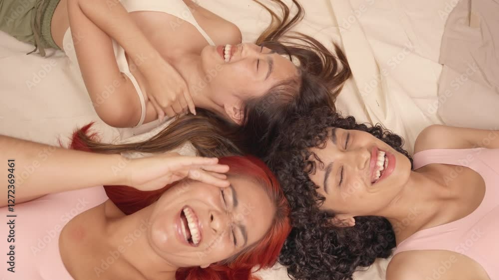 Two happy multiracial models laughing together Two happy multiracial models laughing together