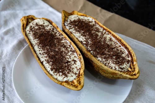 Traditional cupuaçu cream, cupuaçu mousse served in the fruit shell with grated chocolate photo