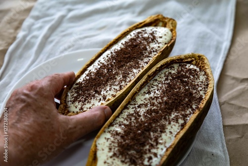 Traditional cupuaçu cream, cupuaçu mousse served in the fruit shell with grated chocolate photo