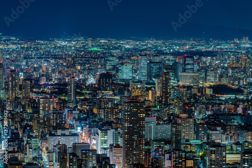 Obraz na płótnie Dense buildings with Osaka castle at Osaka central area at night w salonie