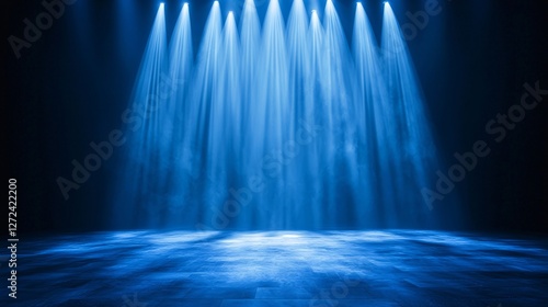 Blue stage lights, smoky floor, dark background, event backdrop