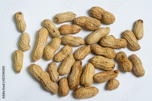 Close-up of Raw Peanuts in Shell on White Surface