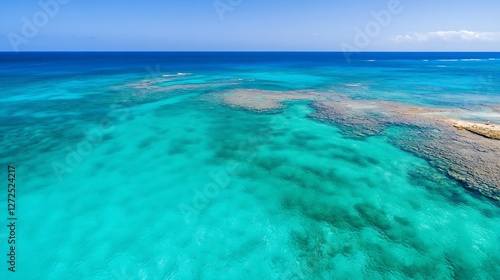 Aerial view of turquoise ocean waters and coral reefs under a bright sky : Generative AI