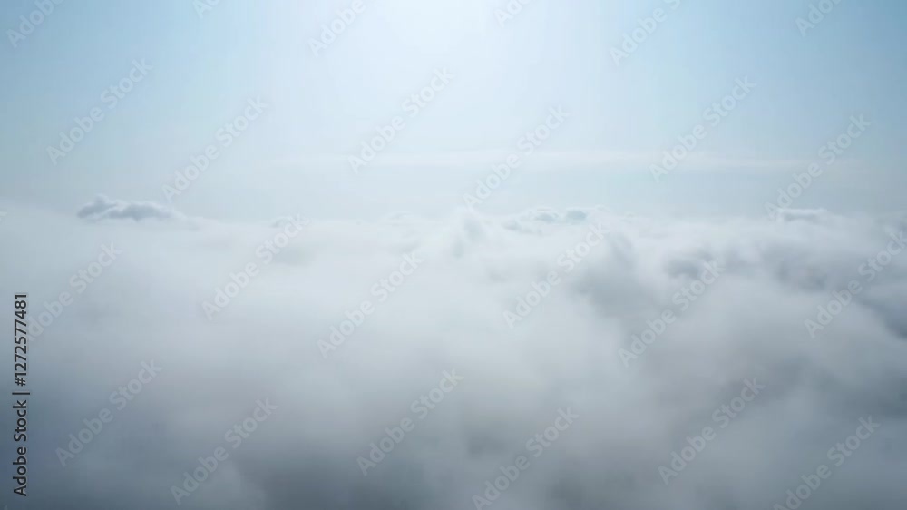 View of city skyline enveloped in clouds on a clear day showcases urban landscape and natural beauty View of city skyline enveloped in clouds on a clear day showcases urban landscape and natural beauty
