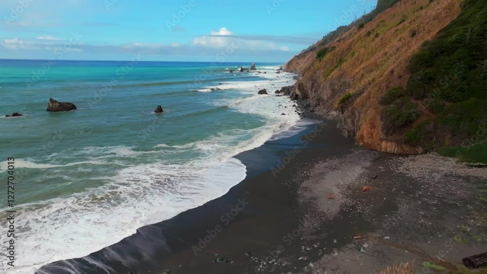Waves crashing surf black sand rugged coastline sunny morning blue sky mist fog layer California aerial drone USAL Beach Campground Lost Coast Trail PNW boulders rocks mountainside forward motion Waves crashing surf black sand rugged coastline sunny morning blue sky mist fog layer California aerial drone USAL Beach Campground Lost Coast Trail PNW boulders rocks mountainside forward motion