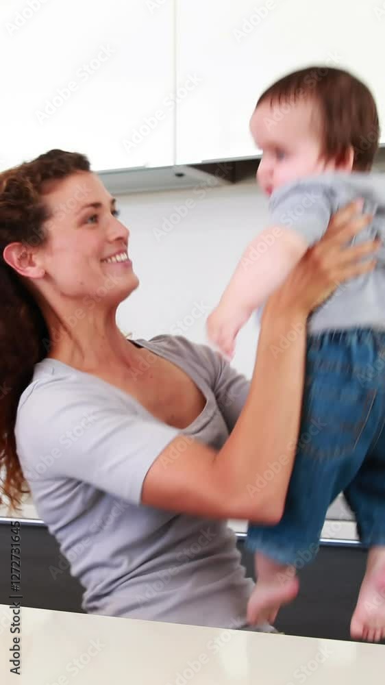 Happy mother playing with baby boy Happy mother playing with baby boy