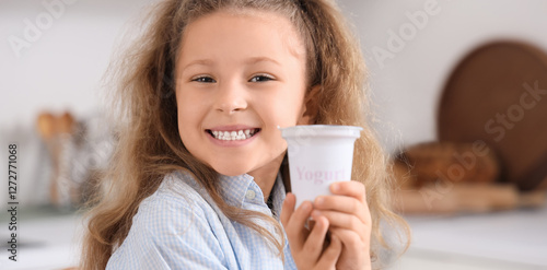 Happy little girl with yogu...