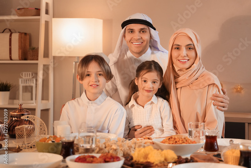 Happy Muslim family having ...